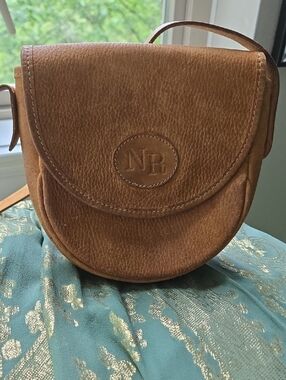 Nina Ricci vintage leather goods Embossed Saddle Crossbody Bag in Warm Brown